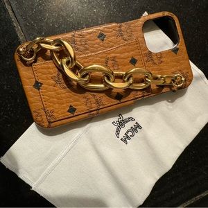 MCM phone case w/ gold chain handle and cc pouch.